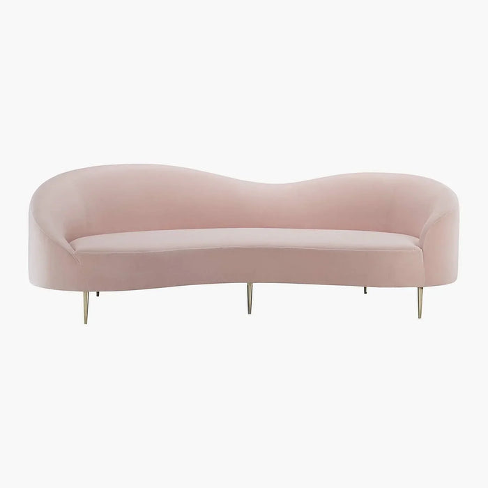 Lorenzo sculptural curved sofa positioned away from a wall